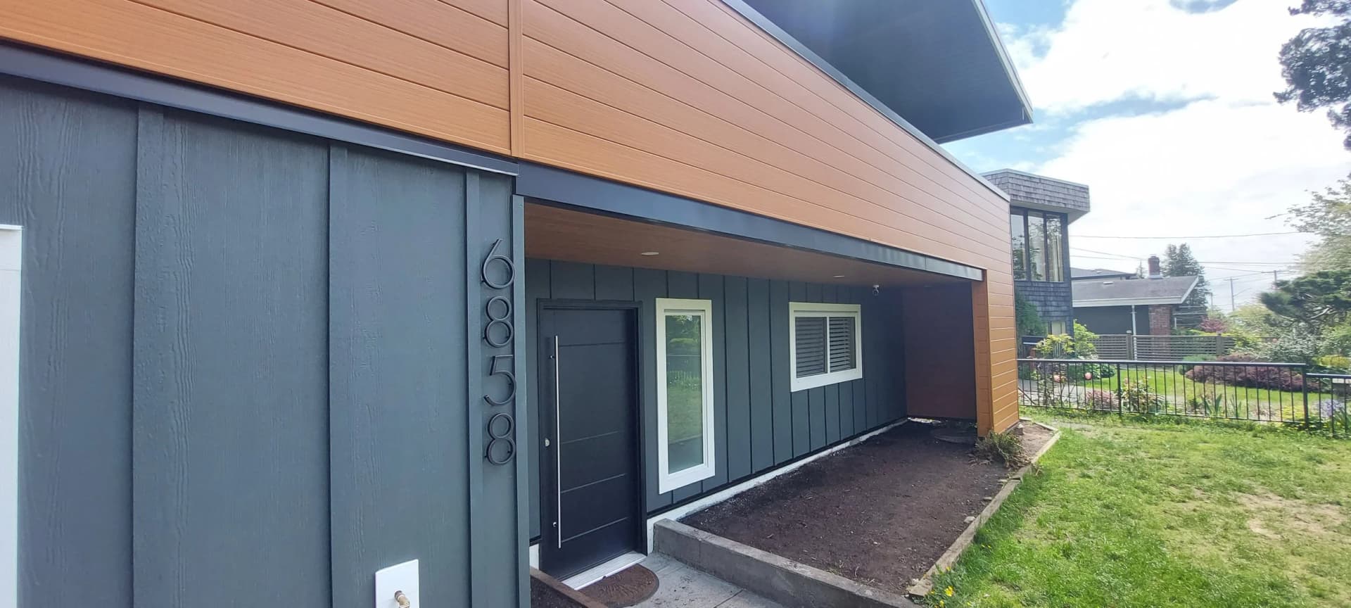 Siding installation with custom exterior trim detailing by Tomron Construction in Burnaby, BC