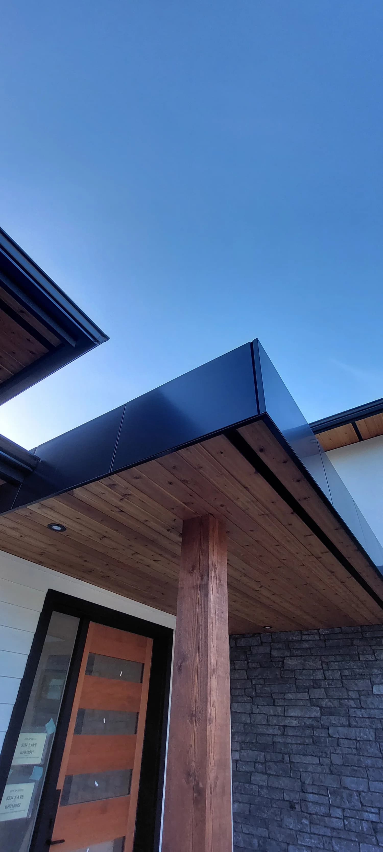 Exterior cladding replacement with modern finish by Tomron Construction in Burnaby, BC