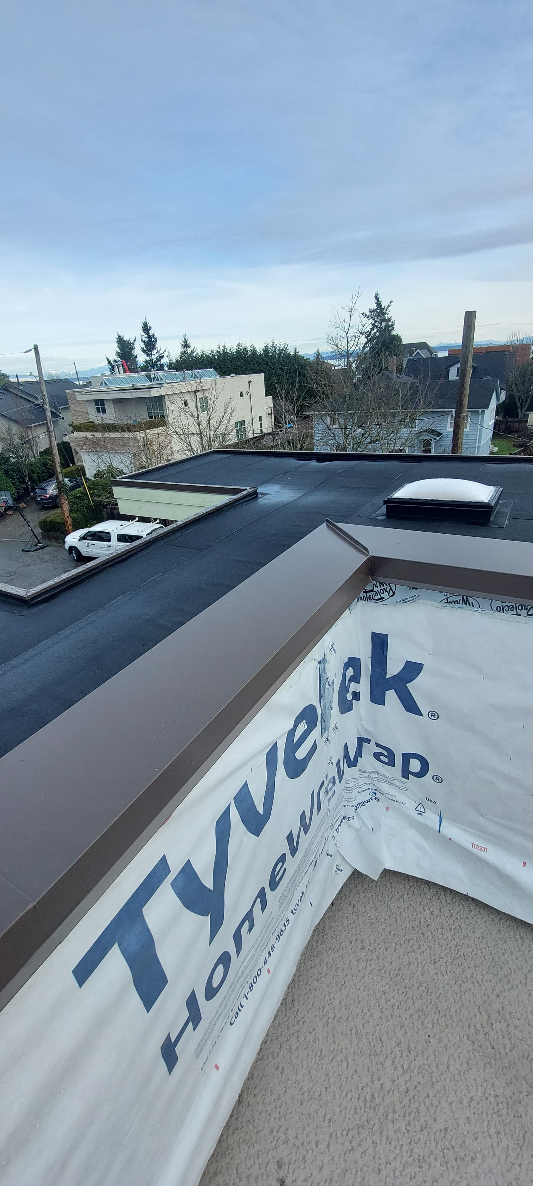 Valley flashing installation on roof intersection by Tomron Construction in Maple Ridge, BC