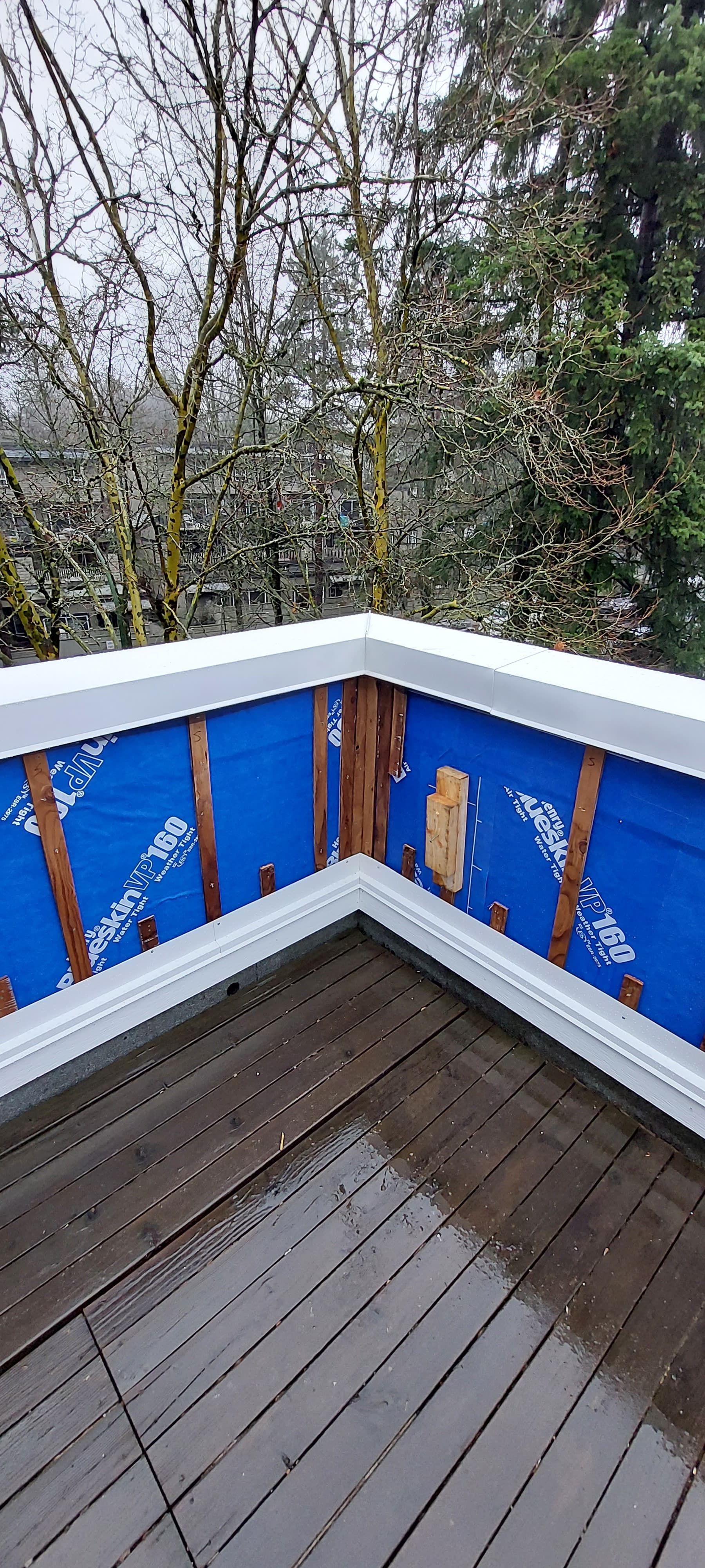 Galvanized metal flashing around vent penetration by Tomron Construction in Maple Ridge, BC