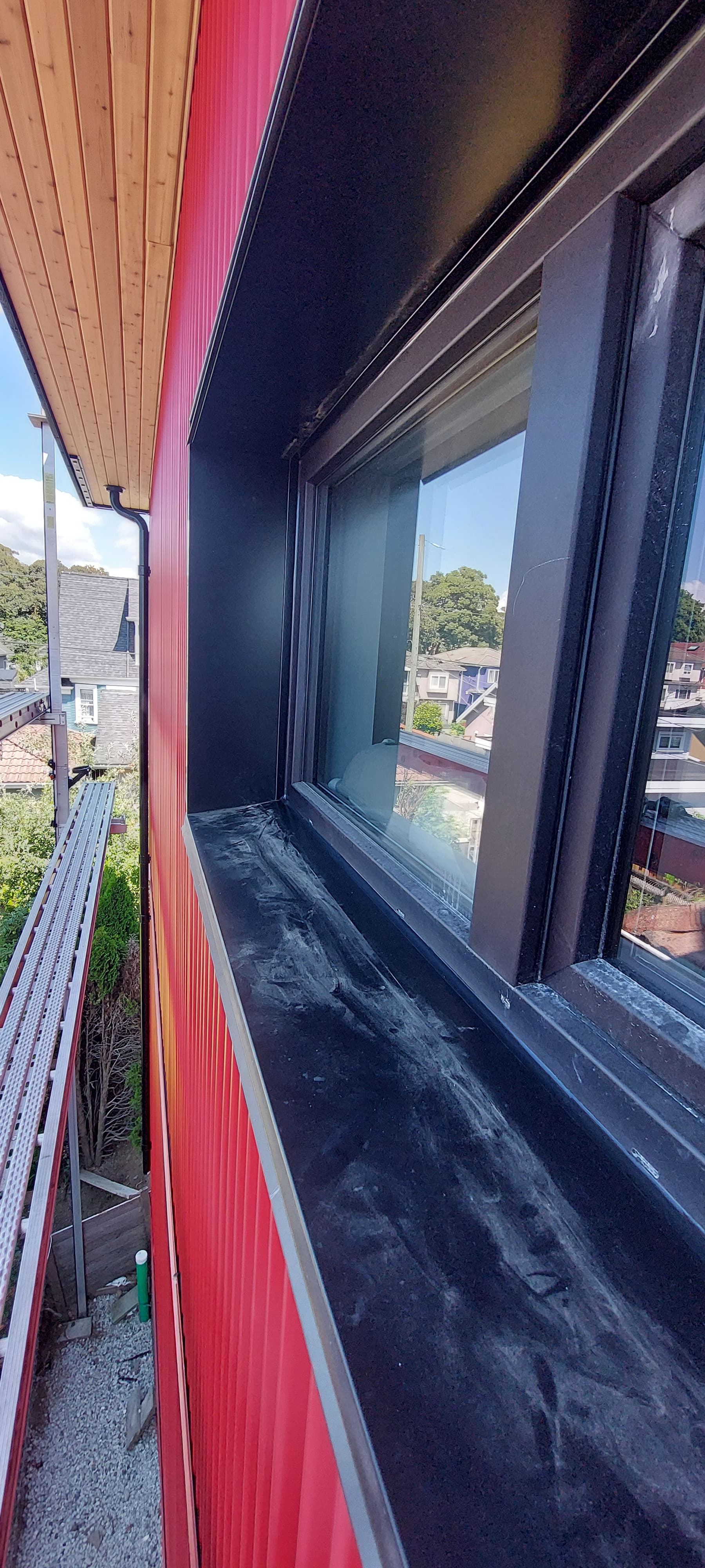 Kick-out flashing diverter at gutter transition by Tomron Construction in Maple Ridge, BC