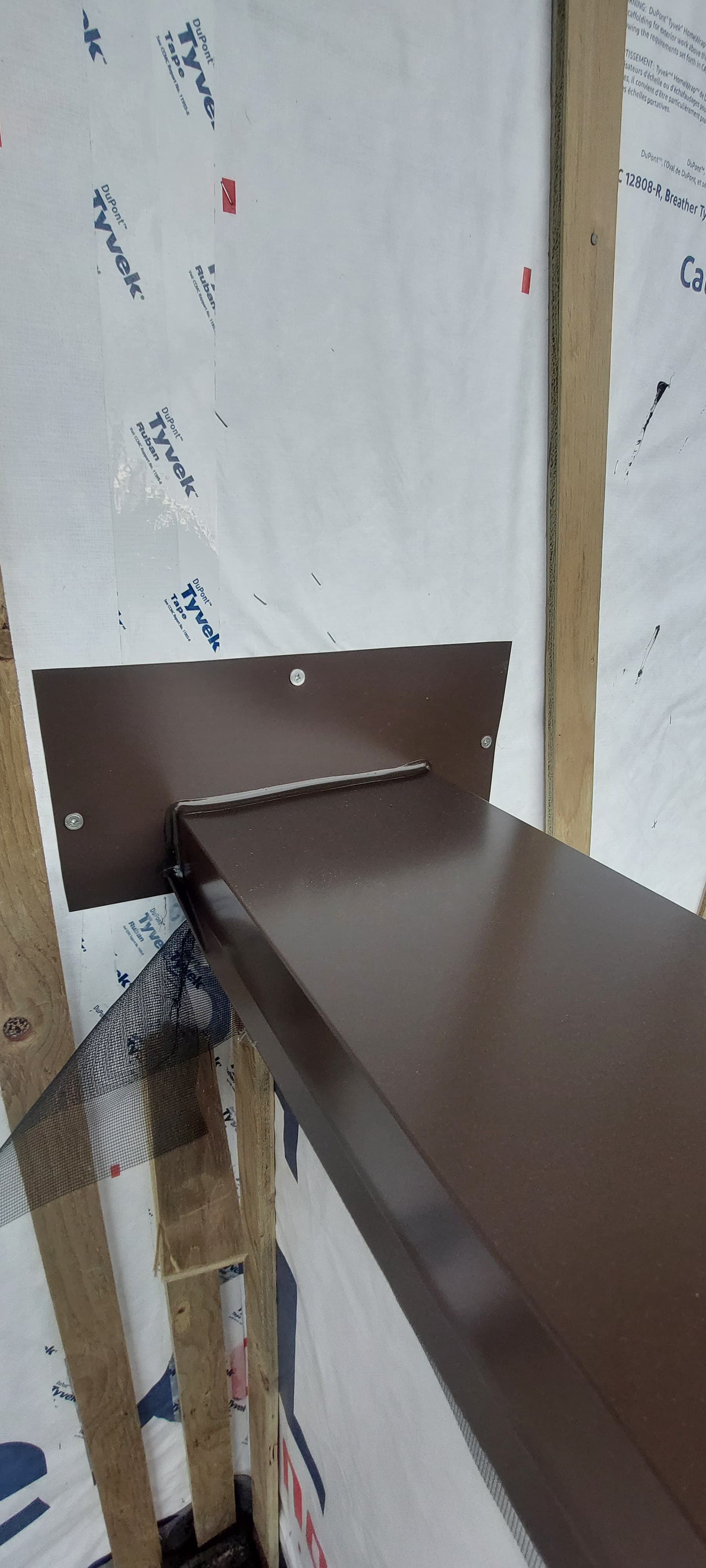 Metal flashing at exterior door threshold by Tomron Construction in Maple Ridge, BC